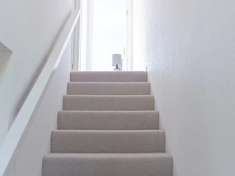 Staircase to upstairs bedrooms.