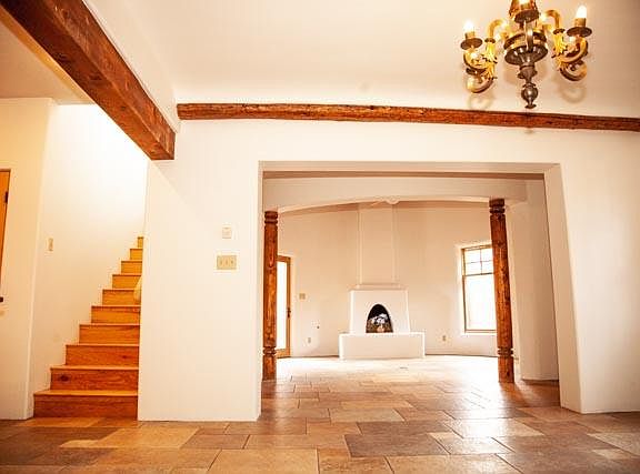 Shot from dining room with kitchen off to left. Very private master is up the stairs. Second bedroom and full bath are on this level, along with third bedroom/office behind photographer.