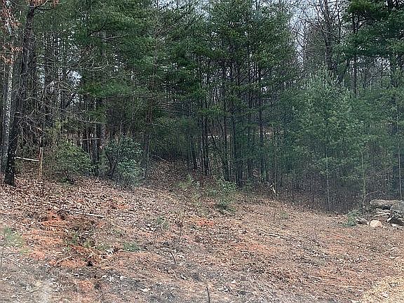 To the left of entrance