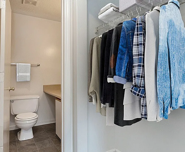 Experience the harmony of design in this convenient closet with connected bathroom.