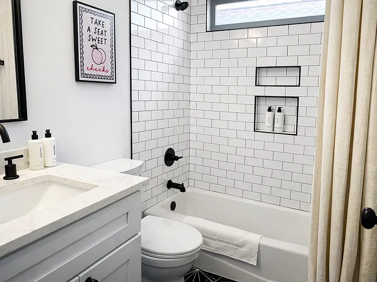 Located off The Krog Suite (downstairs queen bedroom), this spa-inspired bath offers a shower and tub, plush linens, designer interiors, and premium Apotheke products for a true boutique hotel experience.