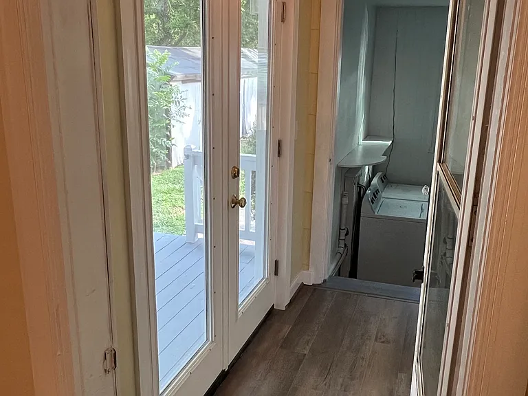 breezeway from kitchen to laundry and exterior door to side porch