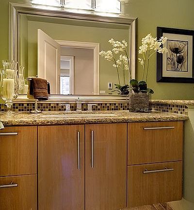 Canyon Creek hung cabinet, slab granite countertop, Delta faucet.