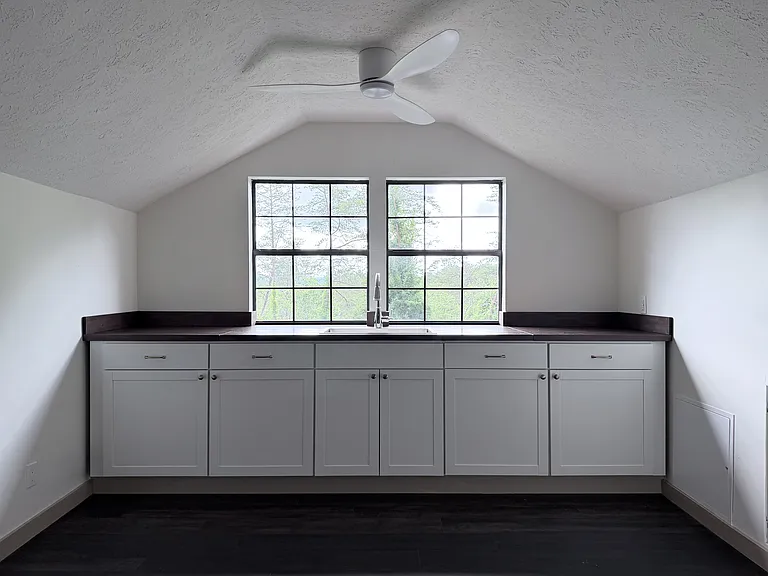 Kitchen, refrigerator and oven on side alcoves. All new appliances.