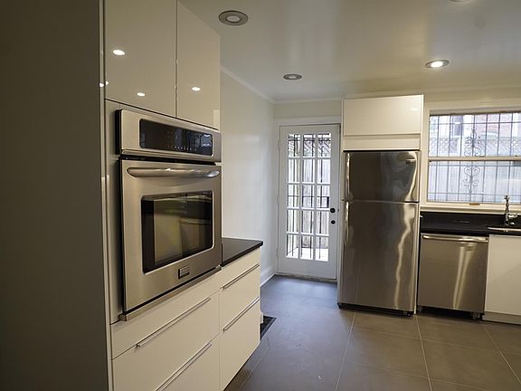 Kitchen; brand new renovation, view to deck