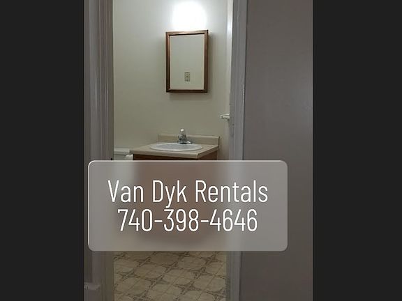 Full bath showing vanity and medicine cabinet.