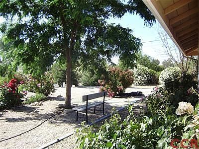 Well manicured rose gardens and fruit trees