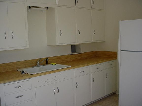 kitchen counter, sink, refrigerator