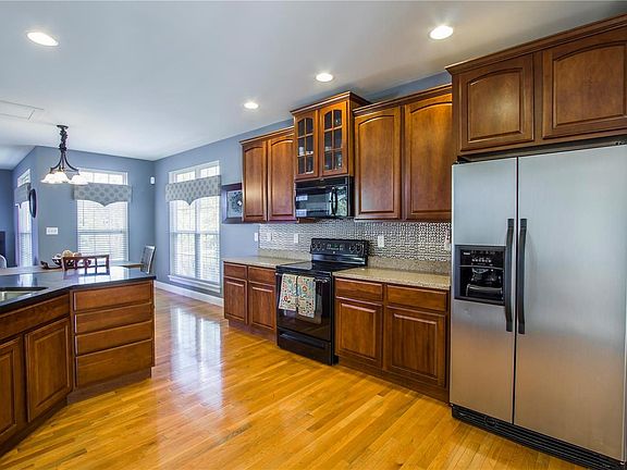 Large kitchen with custom cabinets and walk-in pantry