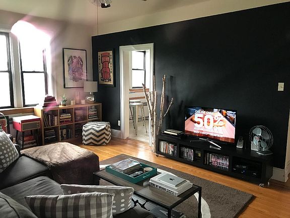 Living room with Hw fls, high ceilings and great natural light