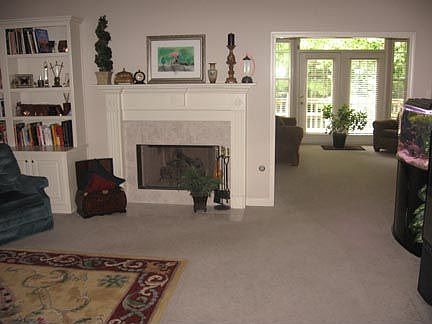 Living room opens into sunroom