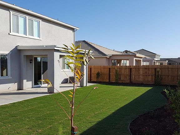 Full patio across back with covered patio