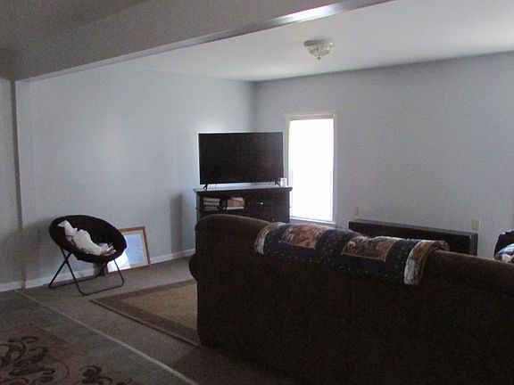 large living room, the door way you see goes into the bedroom, this photo is taken from the view of the kitchen. Furniture is not included.