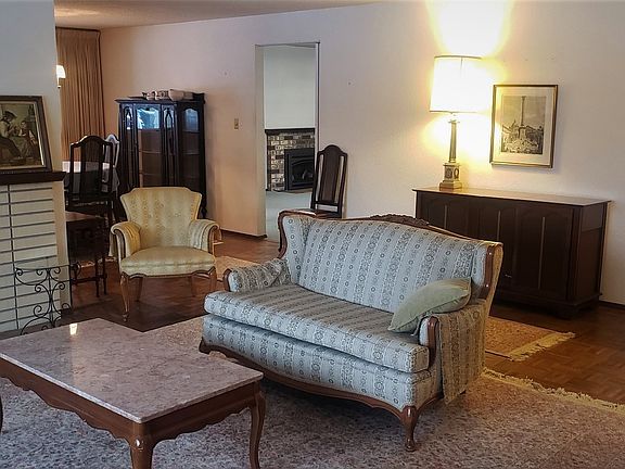 Large living room with wood burning fireplace>