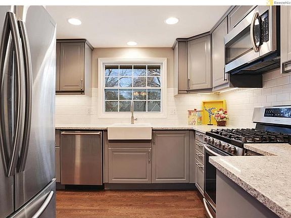 High-end appliances include new gas stove, huge refrigerator