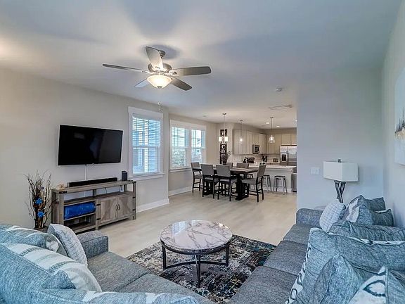 Entertainment space open to dining and kitchen areas