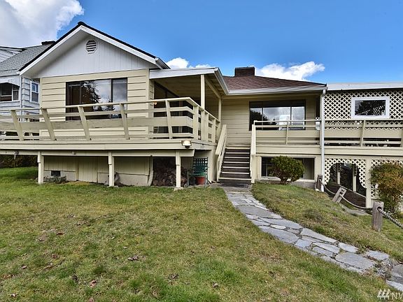 REAR OF RESIDENCE - DECK WRAPS AROUND ON 3 SIDES