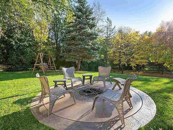 Stepping stones lead from patio to this 12' fire ring!