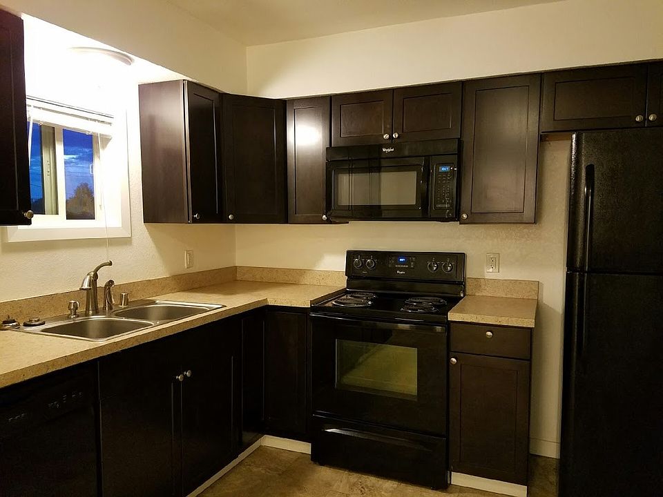 Huge kitchen with dark wood cabinets