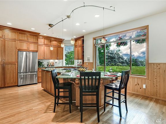 Remodeled Kitchen has Granite Counters;  Large Gas Cook Top Island Can Seat Four 