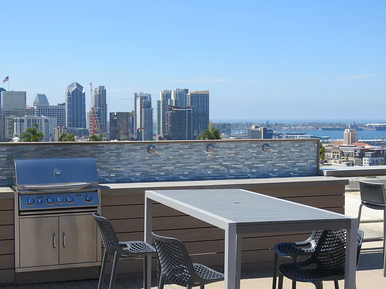 Roof Top Deck With Great Water and City Views. Complimentary Grill and Dining Table.