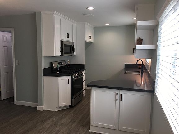 Beautiful new kitchen with lots of cabinets.
