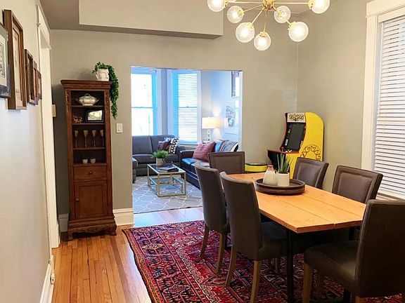 Dining room features vintage rug, custom made dining table, jayson home dining chairs(6), pull out bar.