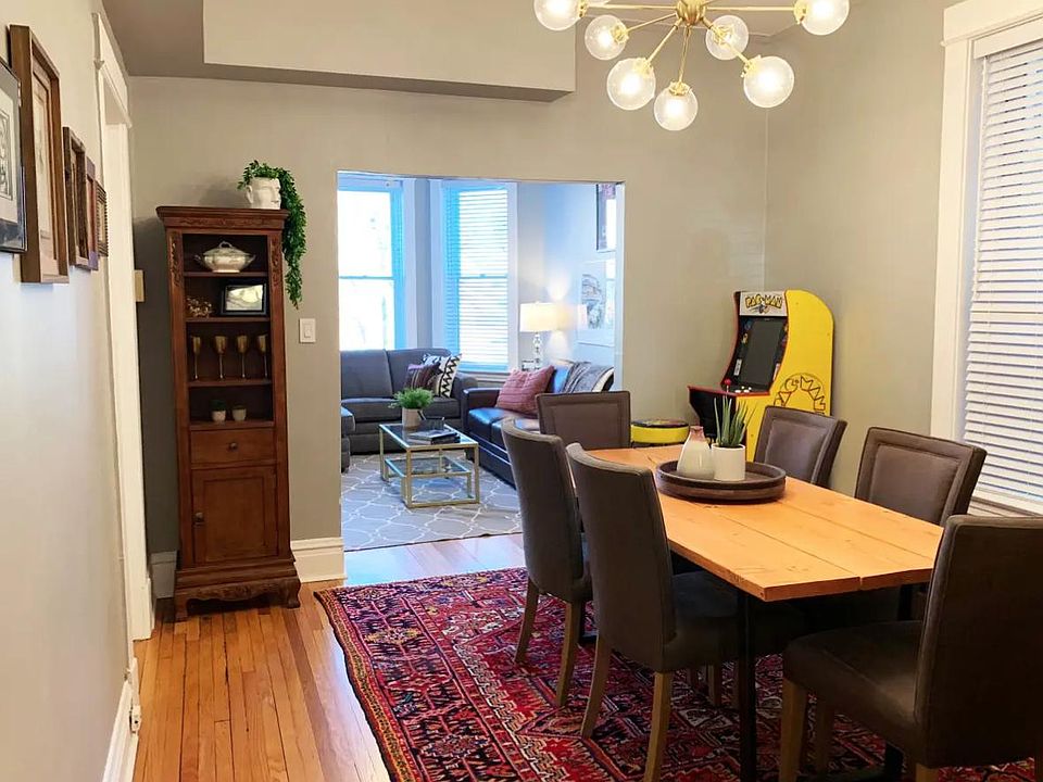 Dining room features vintage rug, custom made dining table, jayson home dining chairs(6), pull out bar.