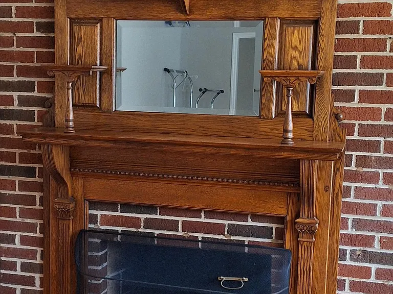 Wood burning fireplace with beautiful mantel