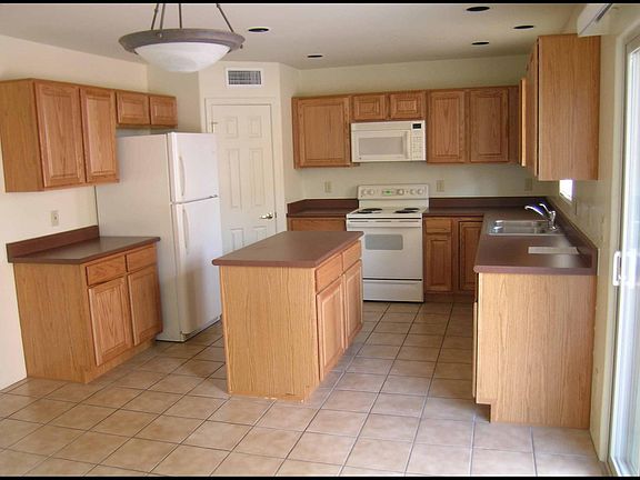 Kitchen with ample storage, Washer/Dryer in garage