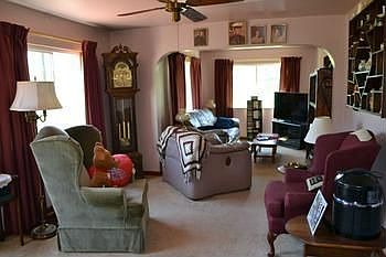 Once inside there is a large living room.  You could have multiple sitting arrangements.  Plenty of windows looking out into the spacious yard.  Neutral colors to match any decor color scheme or style.