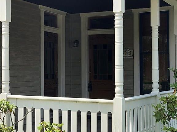 Beautiful curb appeal with this cute covered porch in the front of the home.