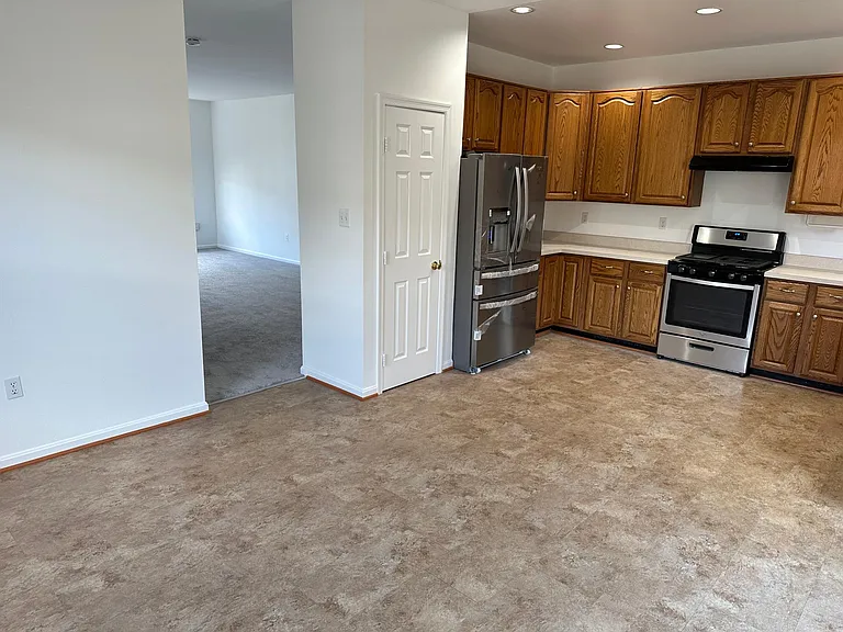 Kitchen looking into living room