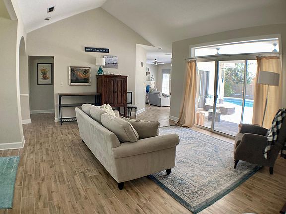 Living room overlooking patio/pool.