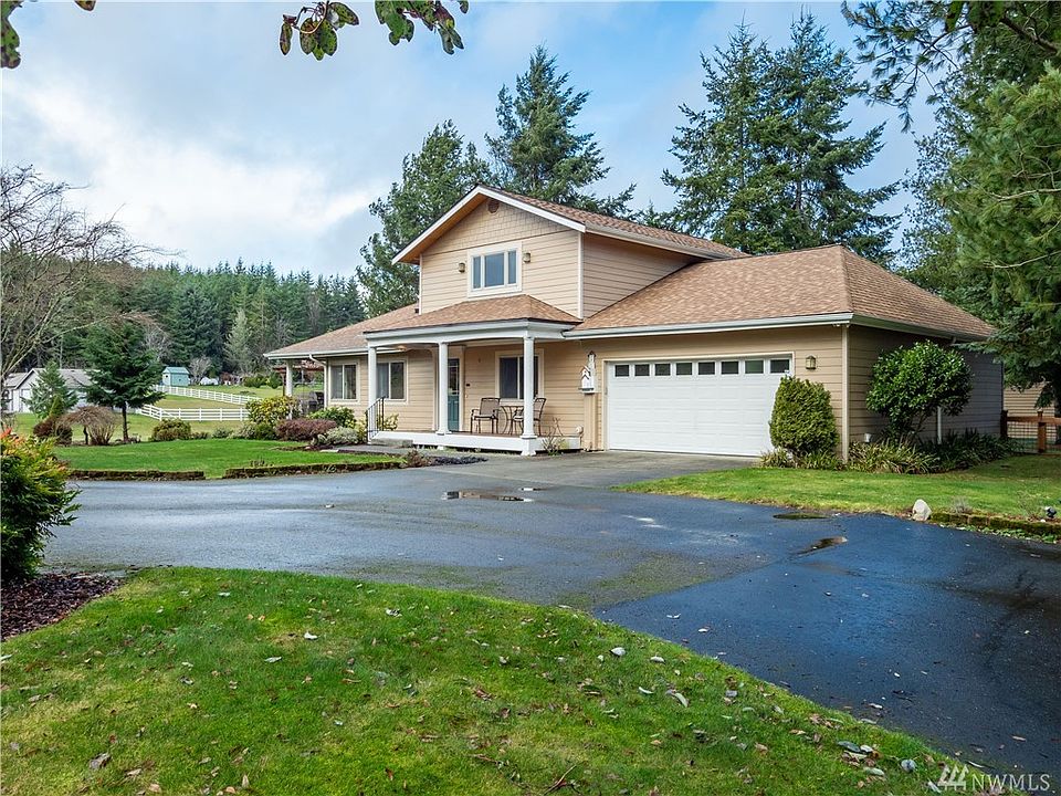 Charming & meticulously maintained custom home on 1.82 acres in Poulsbo. 