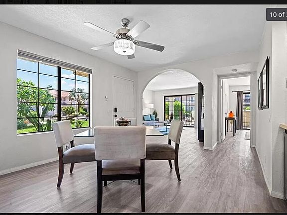 Entry looking into living room and master ensuite (furniture pictured was for staging and is not included