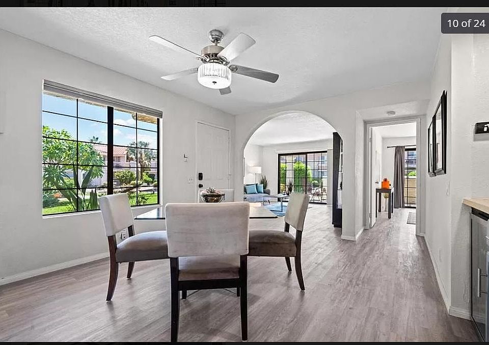 Entry looking into living room and master ensuite (furniture pictured was for staging and is not included