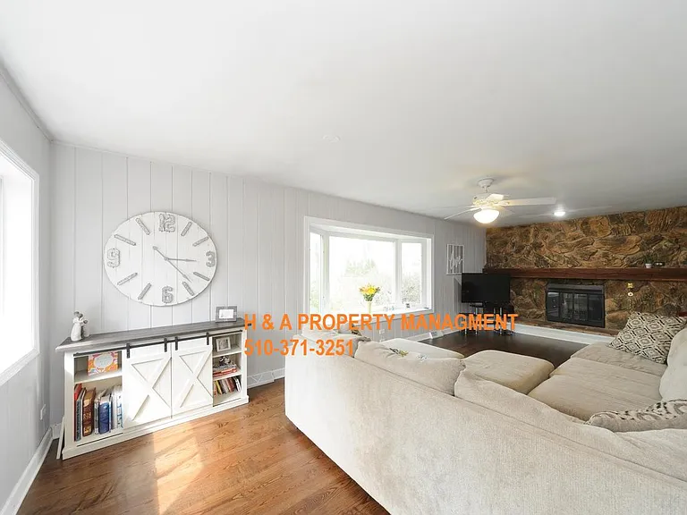 Family room with fire place and lots of natural light