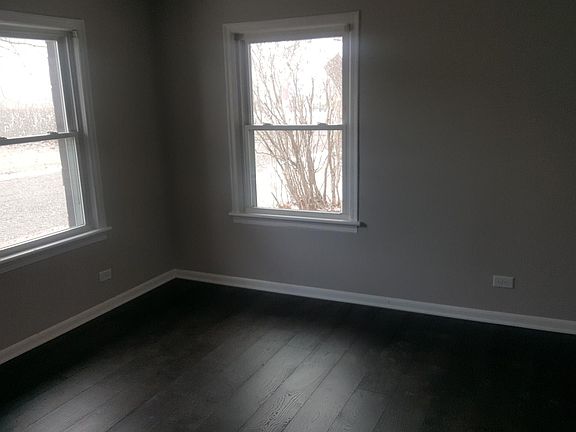 Front bedroom with new hardwood floor