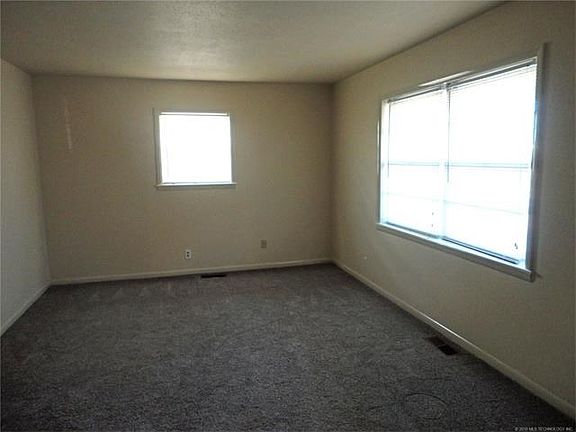 Living room with new carpet (only carpet in home), paint.