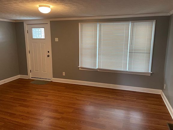 living room with very large widows, and all new blinds