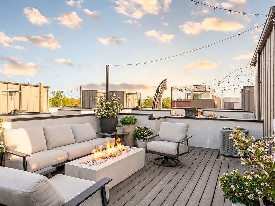 Private rooftop deck with fire pit included - your own outdoor oasis for entertaining or relaxing at sunset.