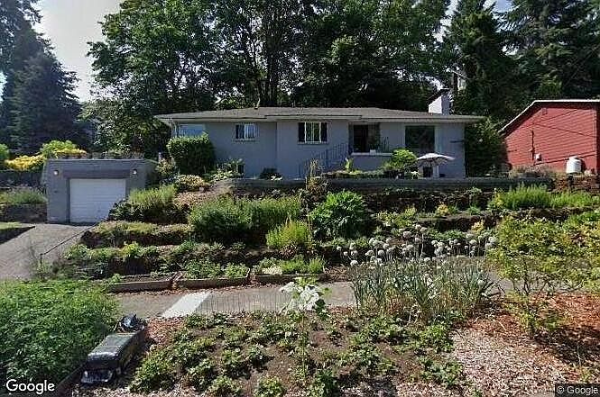 Home exterior. Note that it's been freshly repainted to dark slate grey. Working to get an updated image posted.