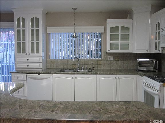 Gorgeous custom kitchen with granite counters, til