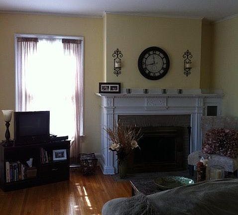 Livingroom with fireplace, wood floors and natural light