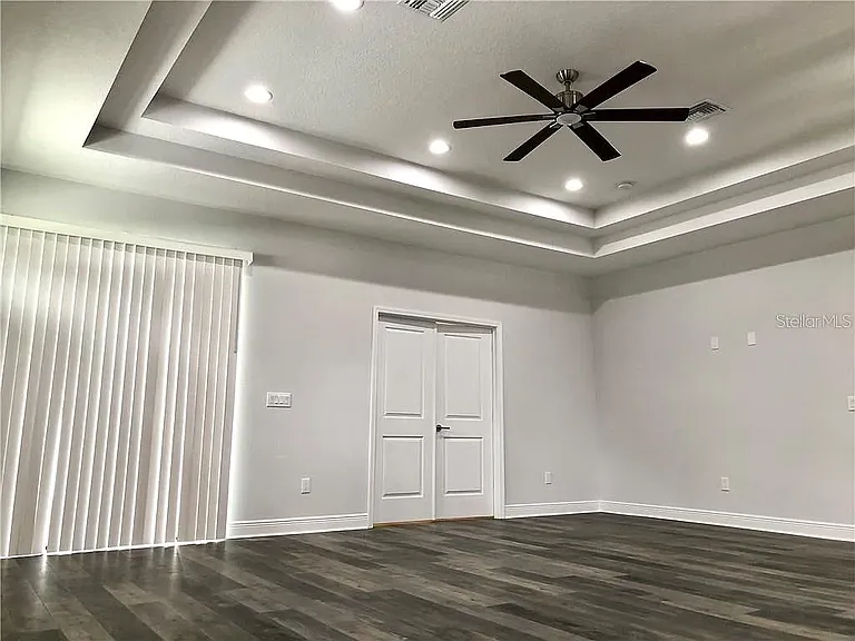 Open Living & Dining Area with Tray Ceiling & Natural Light