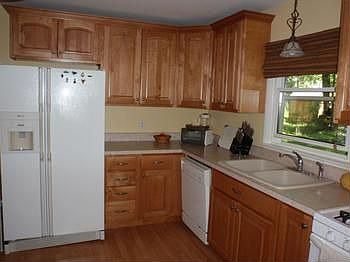 Newer Maple Kitchen Cabinets & Laminate Wood flooring. All the Appliances are included.