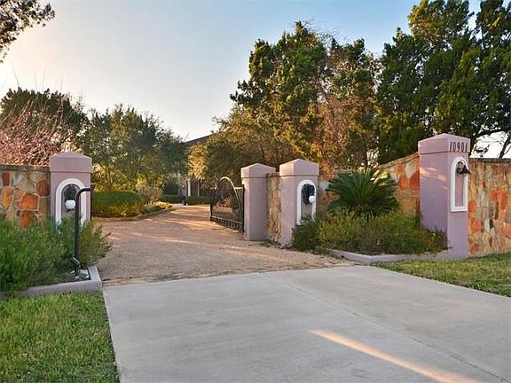 Gated entrance and privacy wall on Hwy 71.