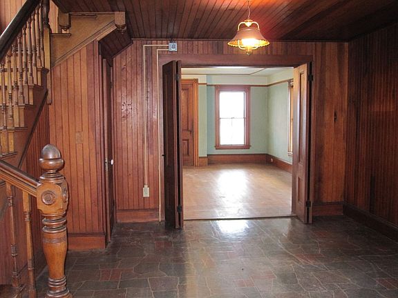 Entryway with original woodwork.