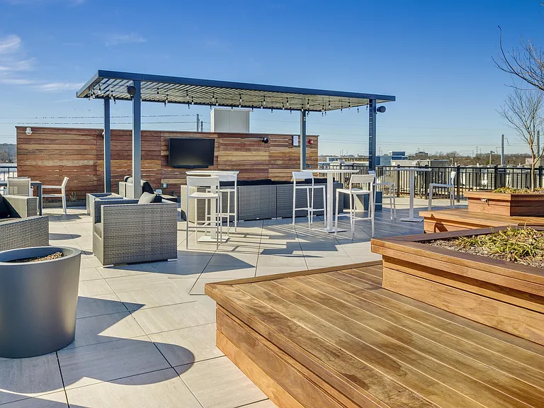 Host family and friends on the rooftop deck with a social lounge and spectacular views